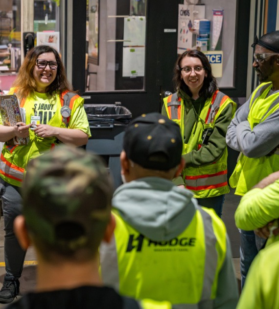 HODGE employees in group meeting